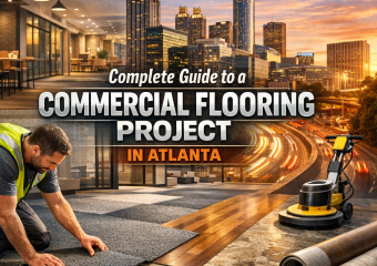 Atlanta skyline backdrop with professionals discussing commercial flooring plans.