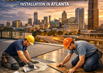 Workers installing flooring with Atlanta skyline in the background.
